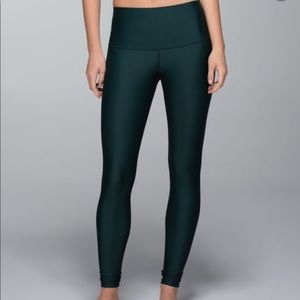 Green, glossy, full-length Lululemon leggings